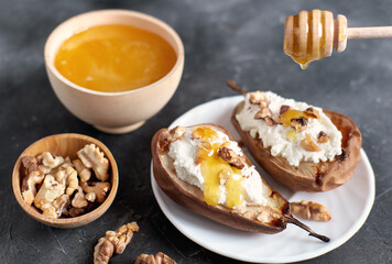 grilled pears baked with ricotta cheese and walnuts. honey topping. dieting sweet dessert,vegetarian food
