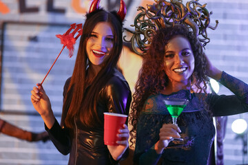 Young women having fun at Halloween party