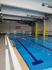 a large, clean and new swimming pool in the educational institution. Swimming tracks and clear water, everything is ready for the competition. Curbstones, pedestals for diving into the water