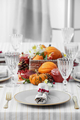 Autumn table serving with rowan in restaurant