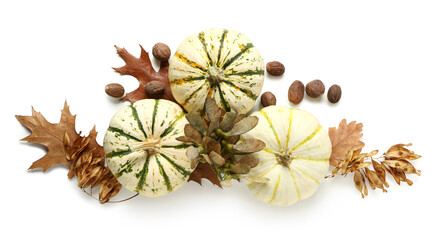 Autumn composition with pumpkins and nutmegs on white background