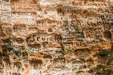 Poster Gutmanis cave is an ancient landmark in Latvia © Fyle