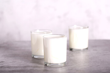 homemade yogurt with berries in glass glasses is on the table