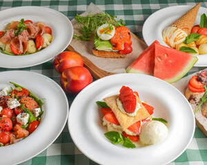 Summerly Watermelon menu dishes on a table with green plaid tablecloth. Side view, design banner.
