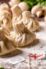 Georgian dumpling or Khinkali. Georgian homemade khinkali on wooden background.