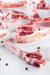 raw lamb ribs on a light background