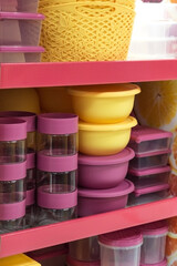 Household goods storage equipment. Various containers for food and for freezing in the shop window for sale. Industrial background with plastic products