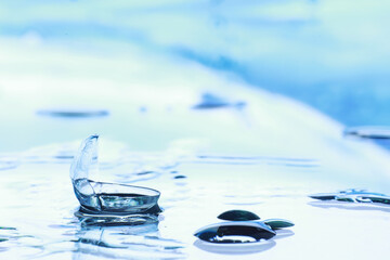 Tools for vision correction. Glasses and lenses with diopters on the background of splashes and...