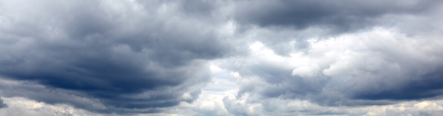 Dramatic black cloud before rainy. Beautiful cloudscape over horizon, sky