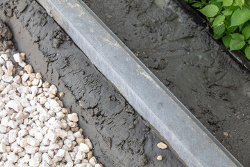 Laying paving slabs at a construction site.