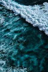 Aerial view to waves in ocean Splashing Waves. Blue clean wavy sea water.