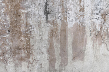 abstract background of an old shabby painted white concrete wall close up