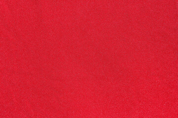 The texture of knitted fabric of red bright color.