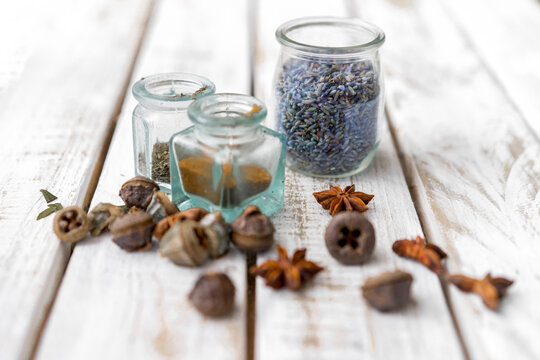 Seeds and spices in jar on table