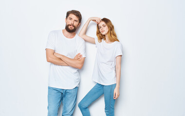 young couple in white t-shirts and jeans Friendship on emotions mockup