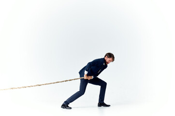 a man in a suit pulls the rope emotion work office