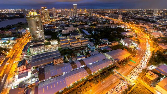 Aerial view of Siam Bangkok intersection or junction with cars traffic skyscraper buildings. Bangkok City in downtown at night, Thailand. 
