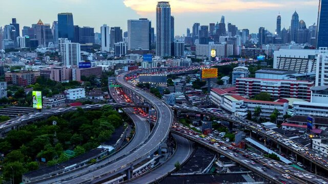 Aerial view of Siam Bangkok intersection or junction with cars traffic skyscraper buildings. Bangkok City in downtown at night, Thailand. 