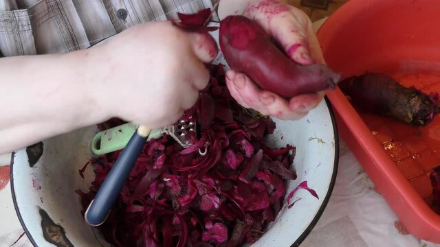 the chef peels the beets. healthy food concept 
