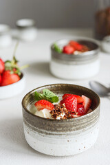 Strawberry, cream cheese and feta cream and crumble crust dessert. Homemade Sweet and salty cheesecake. Trifle. Selective focus
