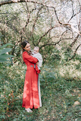 Family shooting in a fairy tale style in an apple grove
