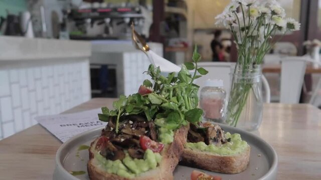 Vegan Plant Based Healthy Avocado Toast with Mushroom at Restaurant