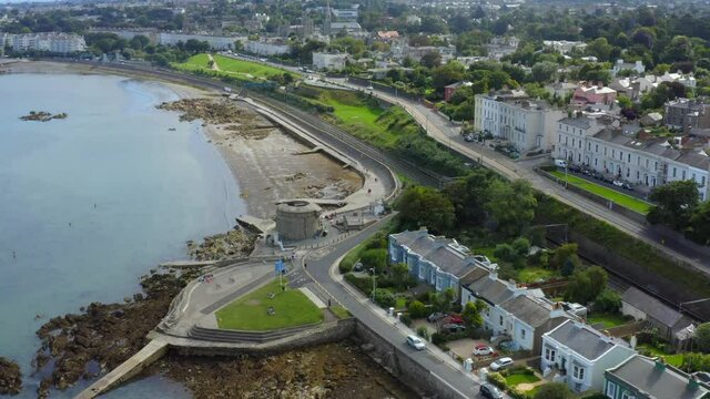 Martello Tower, Seapoint, Monkstown, Dublin, Ireland, September 2021. Drone gradually orbits the tower while ascending above Brighton Vale terrace revealing the view east to D&uacute;n Laoghaire.