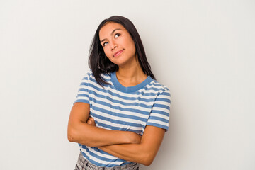 Young latin woman isolated on white background  dreaming of achieving goals and purposes