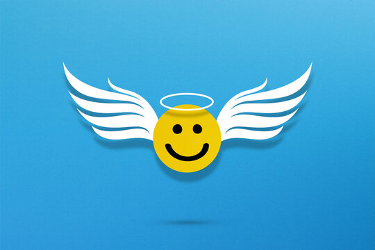 Happy smiley face emoticon with angel wings on blue background