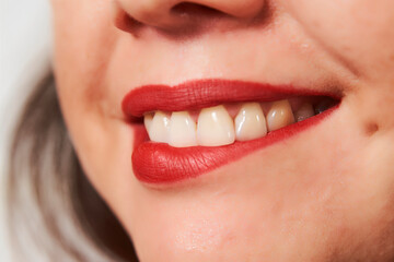 Close up of woman lips with red lipstick.