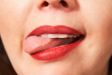 Naklejka premium Close up of woman lips with red lipstick.