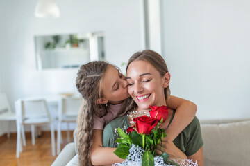 Fototapeta na wymiar I love my you mom! Attractive young woman with little cute girl are spending time together at home, thanking for handmade card with love symbol and flowers. Happy family concept. Mother's day.