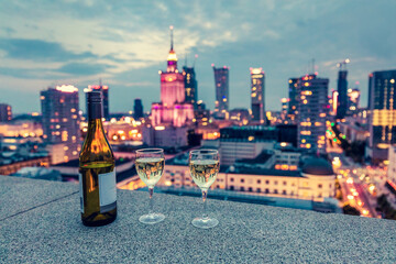 Wine with view on Warsaw, Poland at night