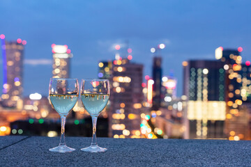 Wine with view on Warsaw, Poland at night