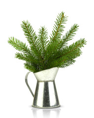 Decorative metal jug with empty spruce branches. isolated sprigs of fir. Christmas concept.