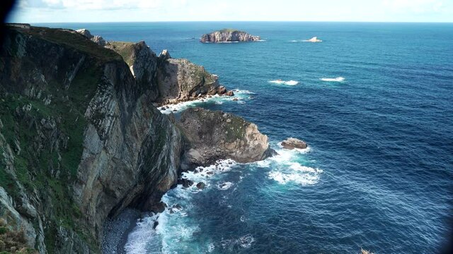 Seascape of Atlantic ocean and Asturias rocky coast at Cape Penas. Sea shore with high cliffs in north Spain.