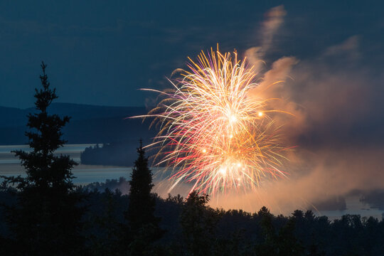 fireworks in the night sky over lake