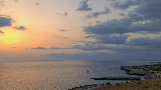 Panning view of Baia Santa Margherita bay in Sicily at sunset near San Vito Lo Capo. Italy
