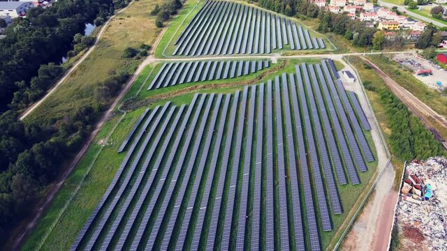 Solar Panels Farm Field Of Green Renewable Energy In Utby, Gothenburg, Sweden - aerial pullback