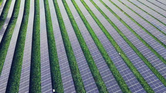 Flying Over Solar Panels At Daytime In Utby, Gothenburg, Sweden - aerial drone shot