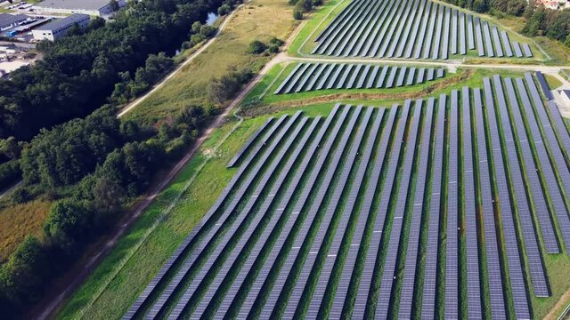 Panoramic View Of Solar Panels On Green Field In Utby, Gothenburg, Sweden - aerial drone shot