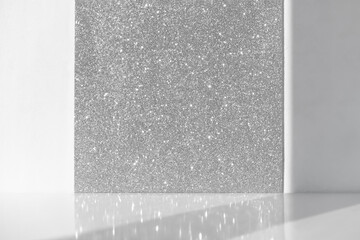 Minimal abstract white-silver shiny sparkling background for the presentation of a cosmetic product...