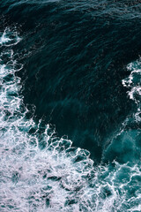 Aerial view to waves in ocean Splashing Waves. Blue clean wavy sea water.