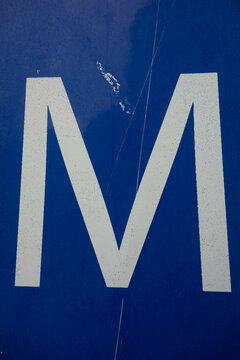 Written Wording in Distressed Typography Found Letter M