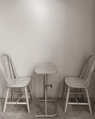 Set table and wood chair in cafe in black and white