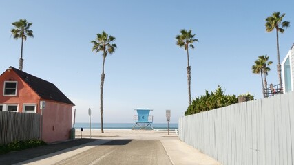 Colorful waterfront cottages, Oceanside California USA. Multicolor bungalow huts, summer sea,...
