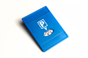 Plastic blue parking disk on white background