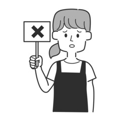 バツが書かれた札を持っているエプロンを着た店員