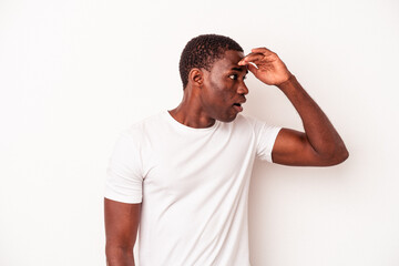 Fototapeta premium Young African American man isolated on white background looking far away keeping hand on forehead.