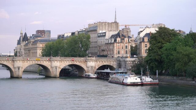 Vedettes du Pont Neuf - Boat Cruise Docked On Square du Vert-Galant In Ile de la Cite In Paris, France. - wide shot
